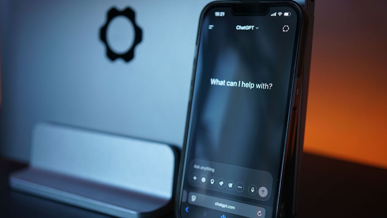 Generative engine optimisation jobs: close-up of a smartphone with AI chat interface, showcasing advanced technology